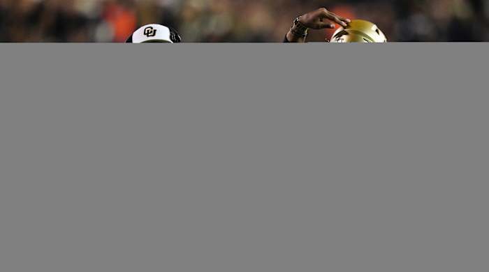 Colorado Buffaloes quarterback Shedeur Sanders (2) and head coach Deion Sanders following a two point conversion vs. Colorado State.